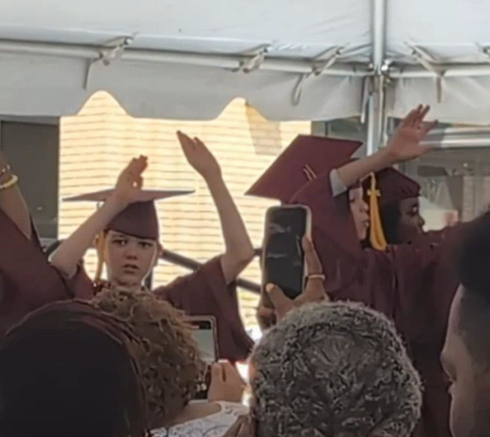 A father’s reaction to his son’s 5th grade graduation. - AVXpro